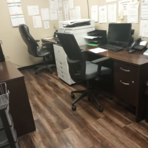 Office furniture for sale in the USA, featuring desks, chairs, and storage solutions in a modern showroom setting.